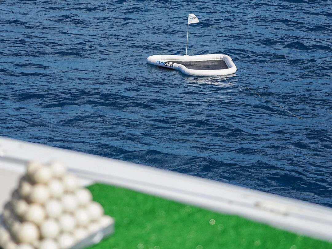 Inflatable floating Yacht Golf Green with a flag