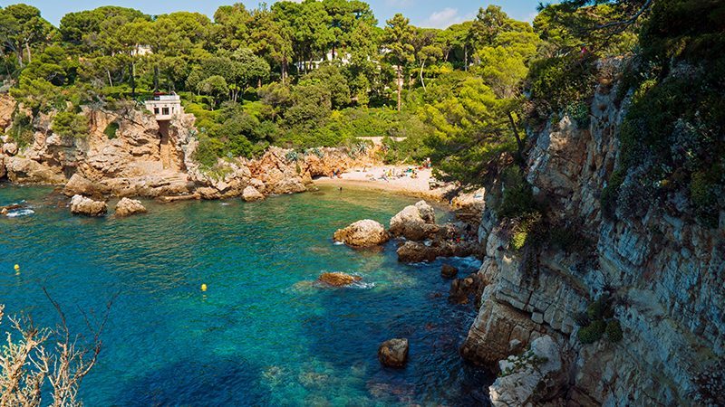 Scenic view of blue sea and beach in Cap D'Antibes in the South of France