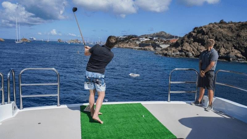 Yacht Golf swing from yacht stern to inflatable greens
