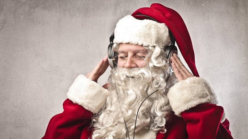 Santa listening to Christmas music
