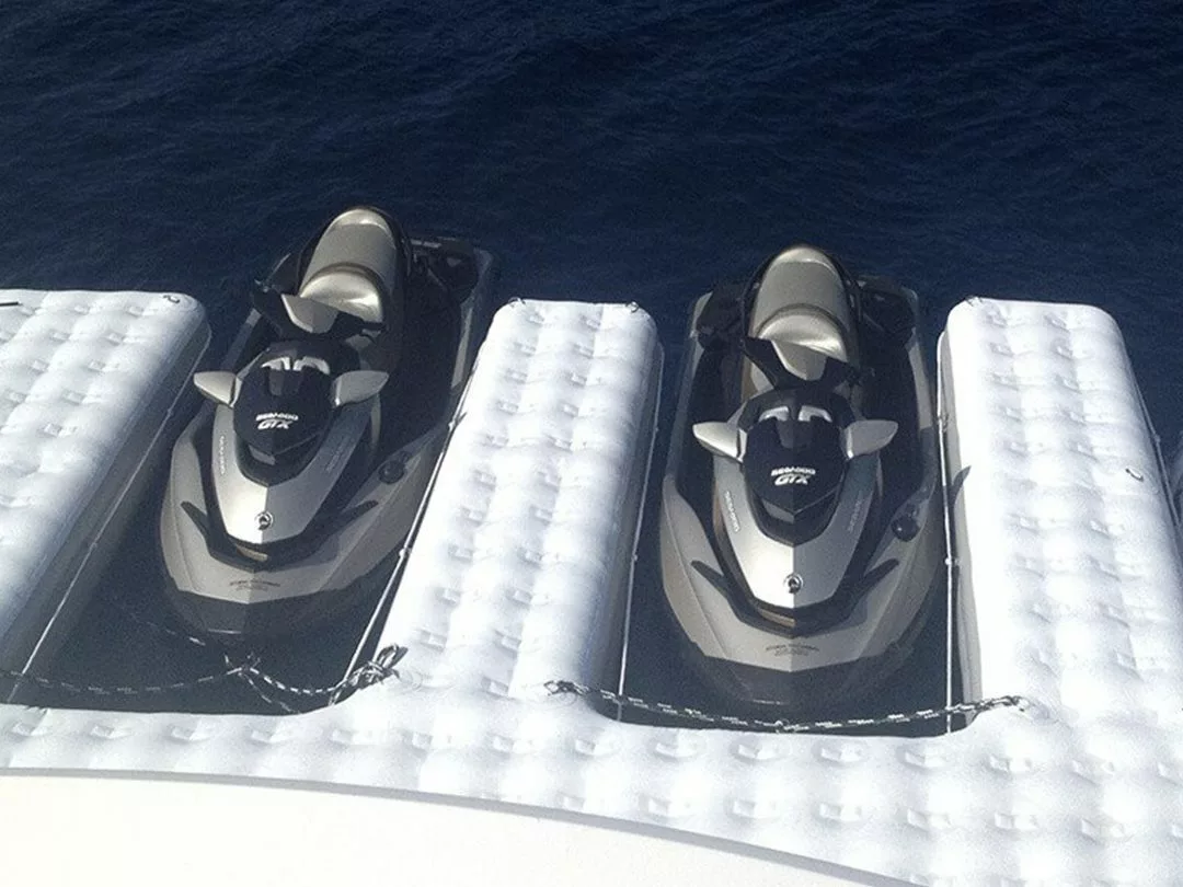 A simple FunAir personal watercraft dock with two docked jet skis and non slip textured surface