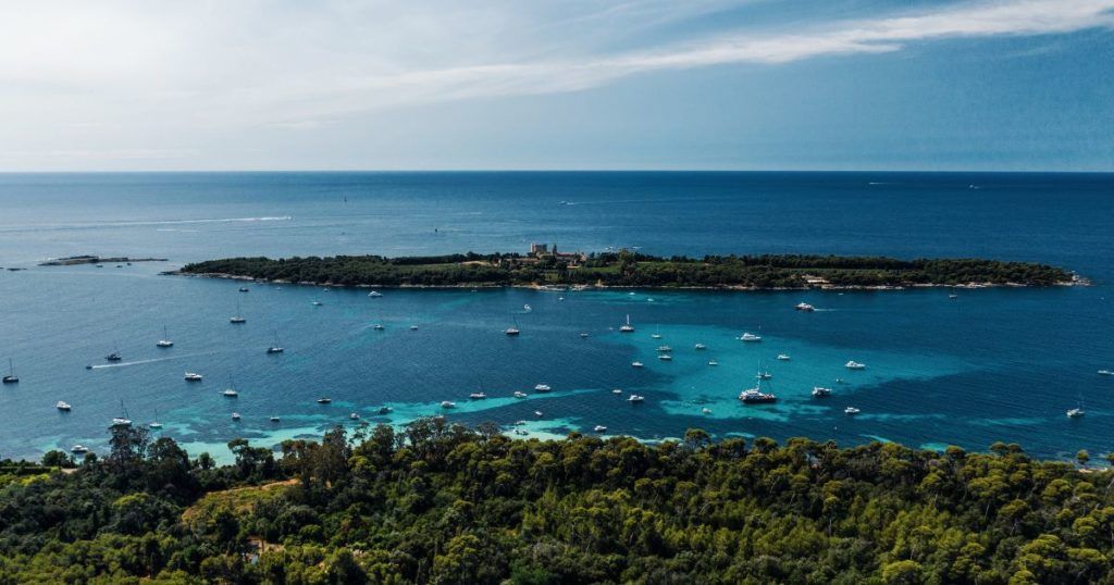 View of yachts in clear blue water at surrounding islands in Cannes, France