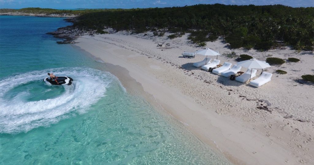 FunAir Wave Loungers on beach with jet ski in ocean