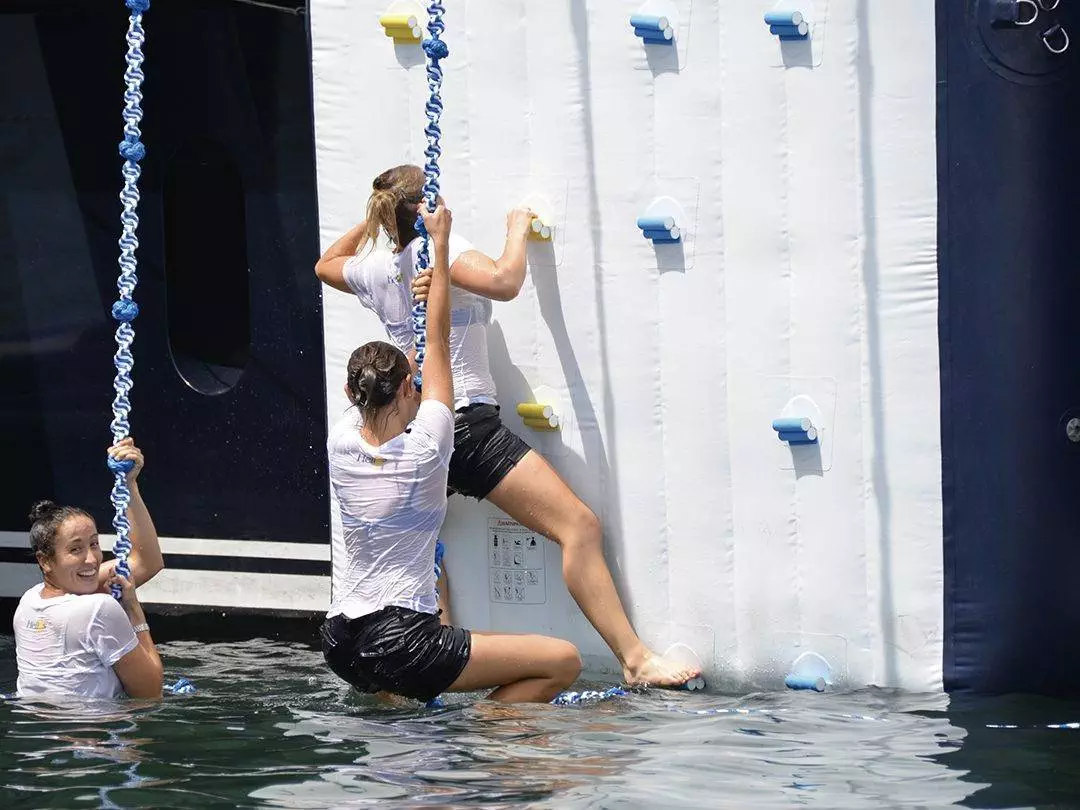 Woman using Water Entry Climbing Wall