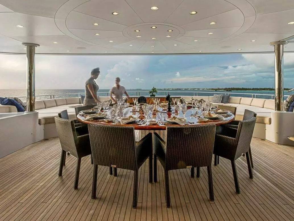 Exterior dining area on superyacht Loon