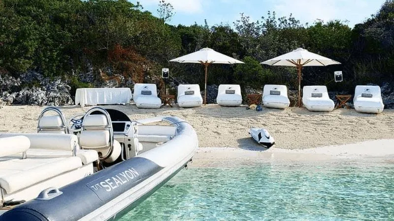 Beach Loungers on white sand with tender and seabobBeach Loungers on white sand with tender and seabobBeach Loungers on white sand with tender and seabob