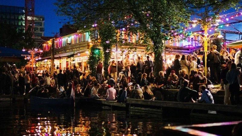 Party venue on the river bank with glowing party lights