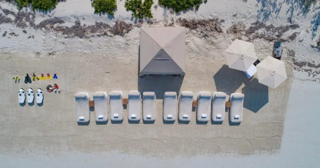 A full beach setup with 10 luxury Inflatable Beach Loungers, yacht toys and a daybed
